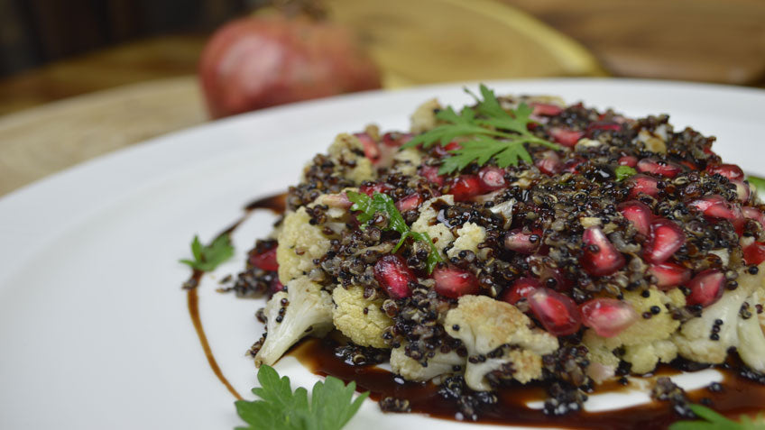 Baked cauliflower salad with goat cheese, quinoa and pomegranate