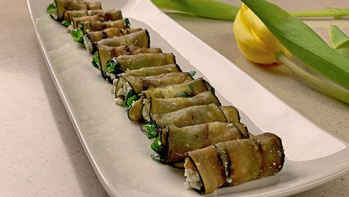 Eggplant, arugula, goat cheese and walnut mini rolls